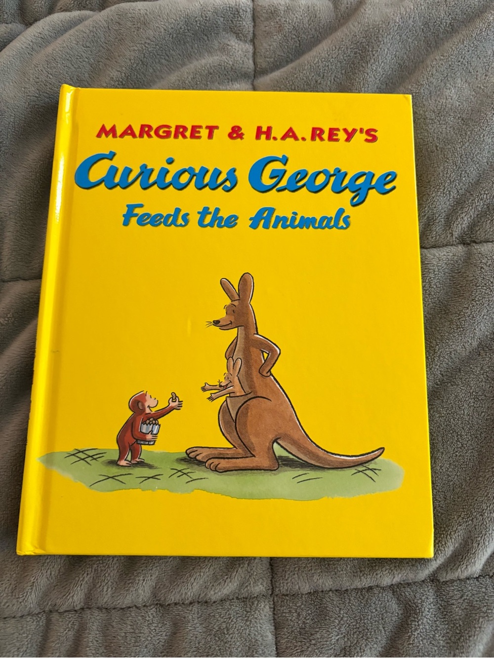 Margret & H.A. Rey's Curious George Feeds the Animals - Yellow Hardcover